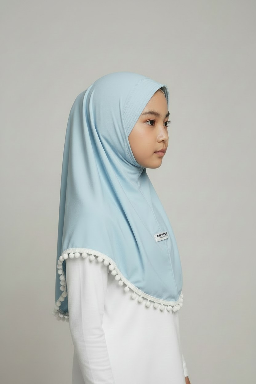 The Manhal Hijab — Girls’ Light Blue Pull-On Hijab with White Pom-Pom Trim