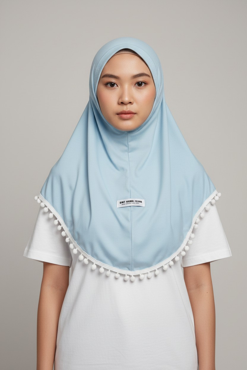 The Manhal Hijab — Girls’ Light Blue Pull-On Hijab with White Pom-Pom Trim